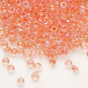 Seed bead, Dyna-Mites™, glass, transparent rainbow inside color peach, #6 round. Sold per 1/2 kilogram pkg.