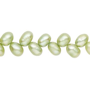 Pearl, cultured freshwater (dyed), lime green, 7x5mm-8x6mm herringbone-drilled rice with 0.4-0.6mm hole, C- grade, Mohs hardness 2-1/2 to 4. Sold per 14-inch strand.