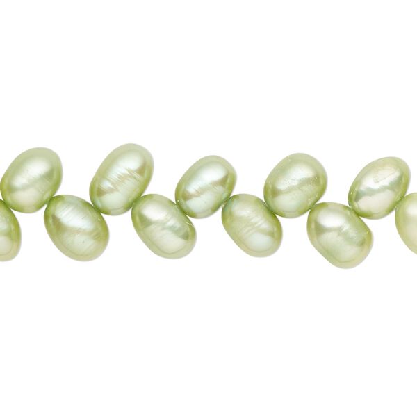 Pearl, cultured freshwater (dyed), lime green, 7x5mm-8x6mm herringbone-drilled rice with 0.4-0.6mm hole, C- grade, Mohs hardness 2-1/2 to 4. Sold per 14-inch strand. image number 0