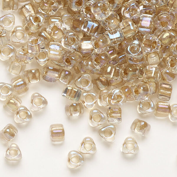 Seed bead, Miyuki, glass, transparent clear color-lined bronze, (TR1133), #5 triangle. Sold per 25-gram pkg. image number 0