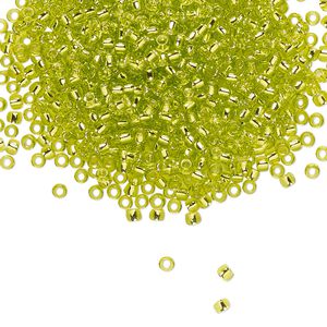 Seed bead, TOHO BEADS®, glass, pkg/250g, #11 round, transparent silver-lined lime green (TR-11-24).