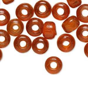 Bead, glass, transparent orange, 9x7mm crow. Sold per pkg of 100.