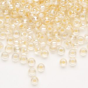Seed bead, Preciosa Ornela Czech glass, pkg/50g, #6 rocaille, translucent color-lined luster pastel apricot, (382PA).