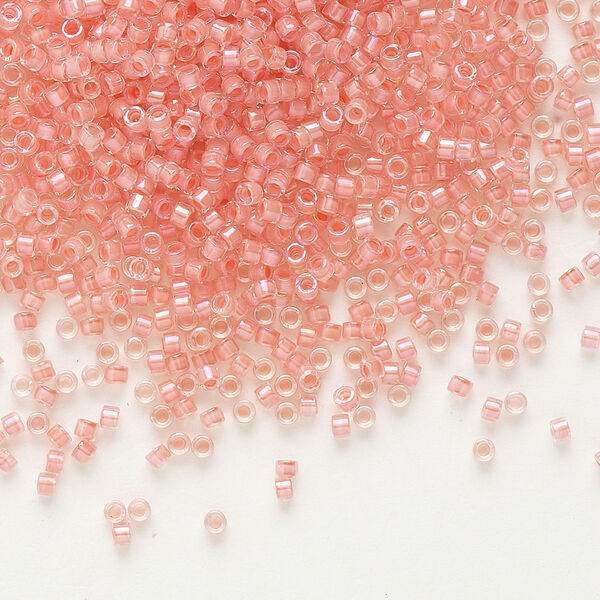 Seed bead, Delica®, glass, pkg/7.5g, #11 round, translucent coral-lined luster crystal clear (DB-0070). image number 0