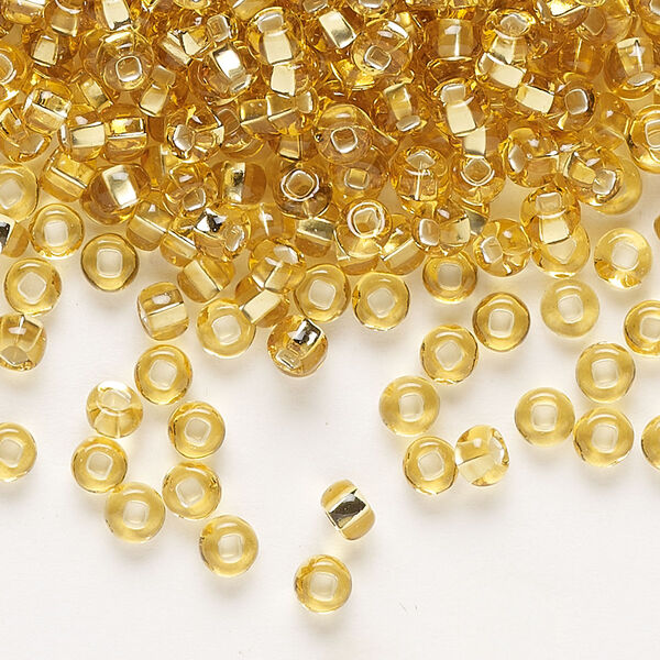 Seed bead, Preciosa Ornela Czech glass, pkg/500g, #6 rocaille, transparent silver-lined light topaz, (17020). image number 0
