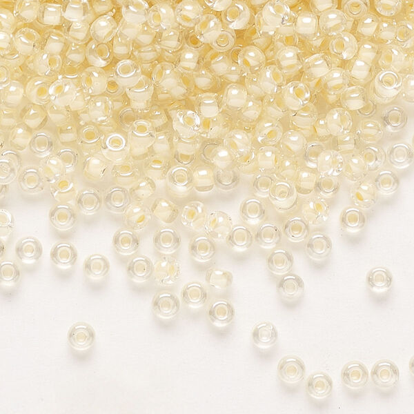 Seed bead, Miyuki, glass, pkg/50g, #8 rocaille, translucent ivory-lined luster crystal clear (RR-2215). image number 0