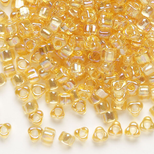 Seed bead, Miyuki, glass, transparent iris amber yellow, (TR1152), #5 triangle. Sold per 25-gram pkg. image number 0