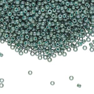 Seed bead, TOHO BEADS®, glass, pkg/250g, #11 round, opaque marbled turquoise blue (TR-11-1207).