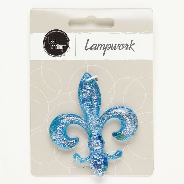 Focal, lampworked glass, opaque and translucent aqua blue / dark blue / green, 60x49mm fleur-de-lis with silver-colored foil. Sold individually. image number 0