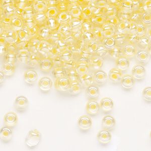Seed bead, Preciosa Ornela Czech glass, pkg/500g, #6 rocaille, translucent color-lined luster pastel yellow, (382PY).