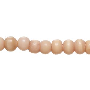 Bead, cat's eye glass (fiber optic glass), peach, 6-8mm irregular round. Sold per 14-inch strand, approximately 70 beads.