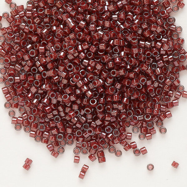 Seed bead, Delica®, glass, pkg/7.5g, #11 round, translucent cranberry-lined luster crystal clear (DB-0280). image number 0