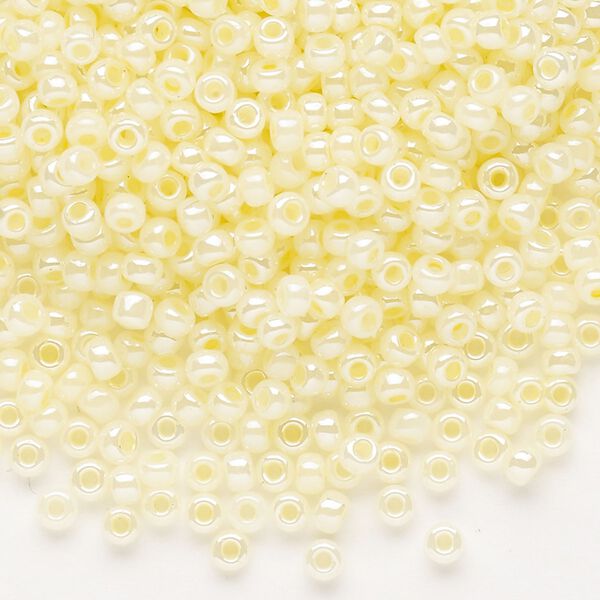 Seed bead, Dyna-Mites™, glass, opaque ceylon pastel cream, #8 round. Sold per 1/2 kilogram pkg. image number 0