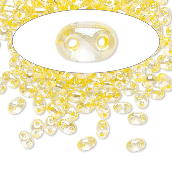 Seed bead, Preciosa Twin™ Czech glass, pkg/50g, 5x2.5mm oval, transparent yellow terra color-lined clear, (38686). image number 0
