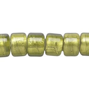 Bead, lampworked glass, semitransparent peridot green with fine silver foil, 12x8mm crow. Sold per 15-1/2" to 16" strand.