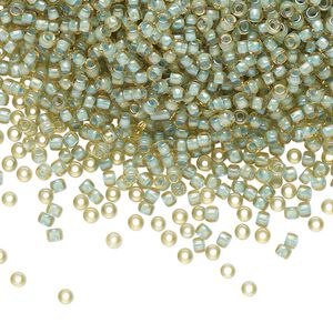 Seed bead, TOHO BEADS®, glass, pkg/50g, #11 round, opaque color-lined seafoam light topaz (TR-11-952).