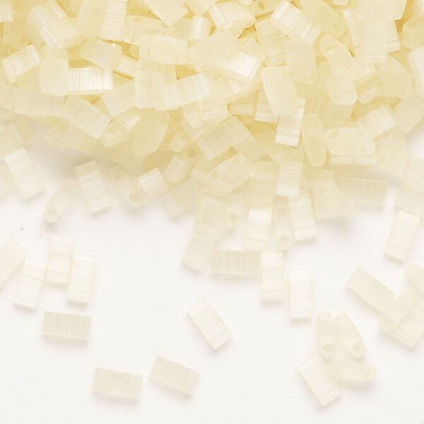 Seed bead, TILA®, glass, pkg/250g, 5x2.3mm half tila rectangle, translucent silk luster light yellow (HTL-2554-1). image number 0