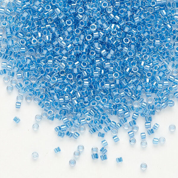 Seed bead, Delica®, glass, pkg/7.5g, #11 round, translucent blue-lined luster crystal clear (DB-0905). image number 0