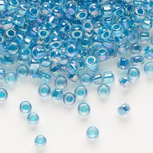 Seed bead, Dyna-Mites™, glass, transparent rainbow inside color teal, #6 round. Sold per 1/2 kilogram pkg.