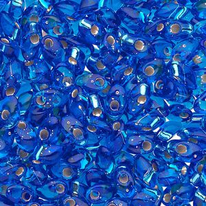 Seed bead, Miyuki, glass, pkg/10g, 7x4mm long magatama, transparent silver-lined cobalt blue (LMA-19).