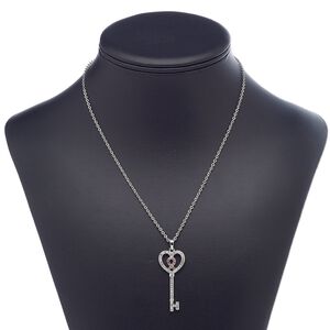 Necklace, glass rhinestone / imitation rhodium-plated brass / steel / "pewter" (zinc-based alloy), clear and pink, 43x18mm key with awareness ribbon, 18 inches with 3-inch extender chain and lobster claw clasp. Sold individually.