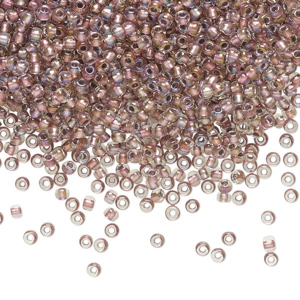 Seed bead, TOHO BEADS®, glass, pkg/7.5g, #11 round, translucent rose gold-lined crystal clear (TR-11-267). image number 0