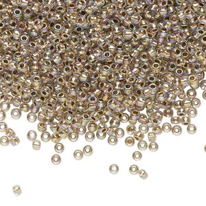 Seed bead, TOHO BEADS®, glass, pkg/7.5g, #11 round, translucent gold-lined rainbow crystal clear (TR-11-994).