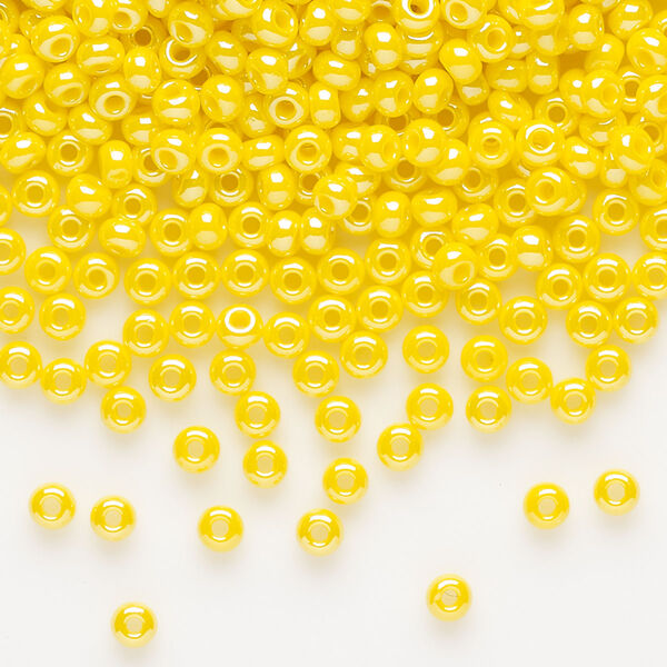 Seed bead, Preciosa Ornela, glass, opaque luster yellow, #8 rocaille. Sold per 50-gram pkg. image number 0
