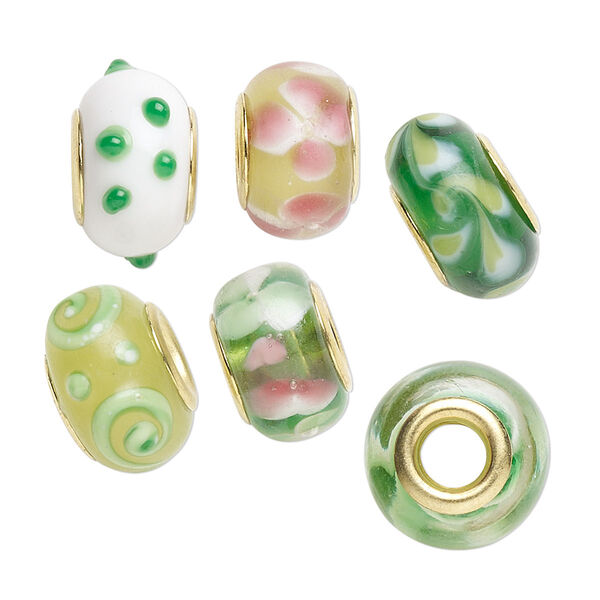 Bead, Dione®, lampworked glass and gold-finished brass grommets, transparent green and opaque multicolored, 12x8mm-16x9mm rondelle with assorted designs. Sold per pkg of 6. image number 0
