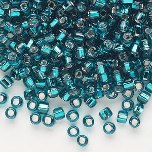 Seed bead, Dyna-Mites™, glass, silver-lined translucent teal blue, #6 round with square hole. Sold per 40-gram pkg.