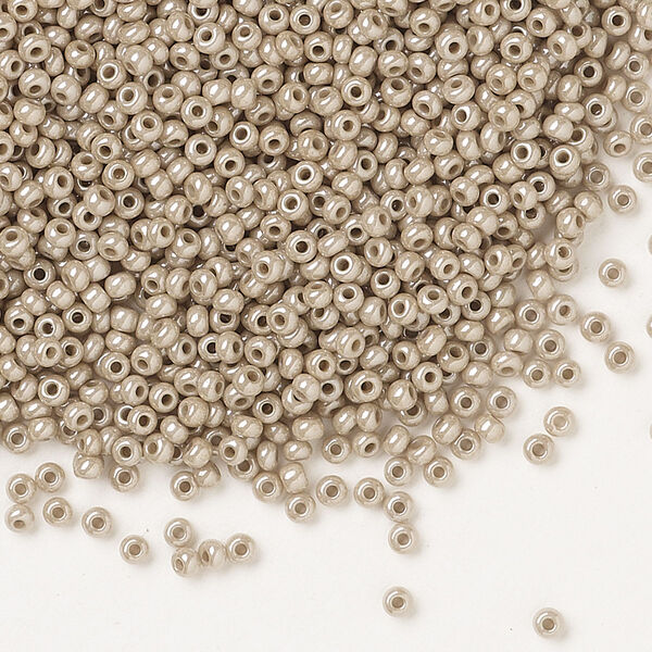 Seed bead, Preciosa Ornela Czech glass, pkg/50g, #11 rocaille, opaque beige luster chalkwhite, (46088). image number 0