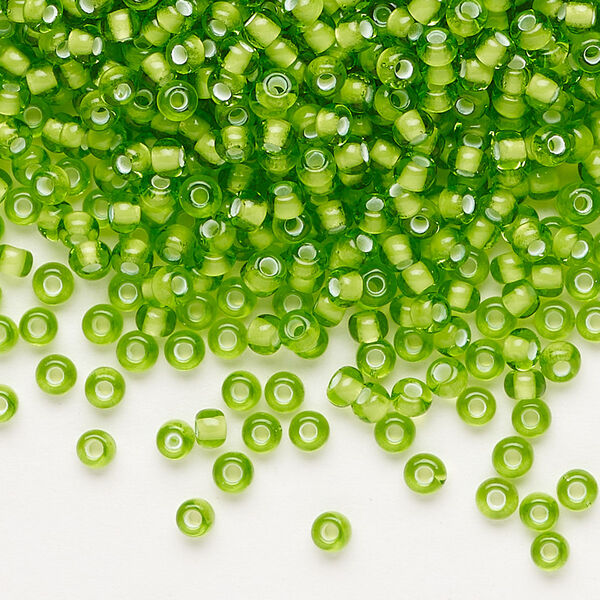 Seed bead, Preciosa Ornela, glass, transparent chalkwhite-lined green, #8 rocaille. Sold per 500-gram pkg. image number 0