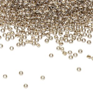 Seed bead, TOHO BEADS®, glass, pkg/250g, #11 round, transparent gold-lined crystal clear (TR-11-989).