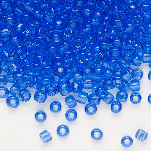 Seed bead, Dyna-Mites™, glass, transparent light blue, #6 round. Sold per 1/2 kilogram pkg. image number 0