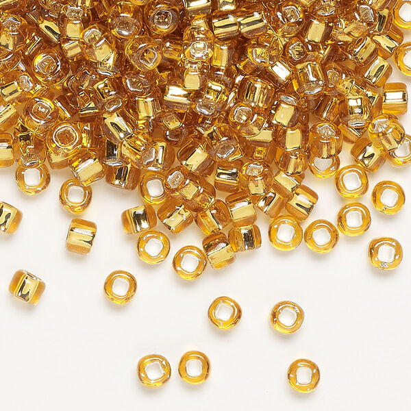 Seed bead, Dyna-Mites™, glass, silver-lined translucent gold, #6 round with square hole. Sold per 1/2 kilogram pkg. image number 0