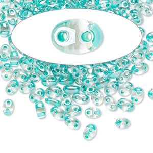 Seed bead, Preciosa Twin™ Czech glass, pkg/50g, 5x2.5mm oval, transparent green terra color-lined clear, (38658).