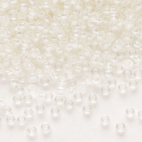 Seed bead, Preciosa Ornela Czech glass, pkg/50g, #11 rocaille, translucent color-lined luster pastel ivory, (382PI). image number 0