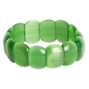 Bracelet, Just for Fun, stretch, cat's eye glass (fiber optic glass), green, 17mm flat oval, 17mm width, 6-inches. Sold individually.