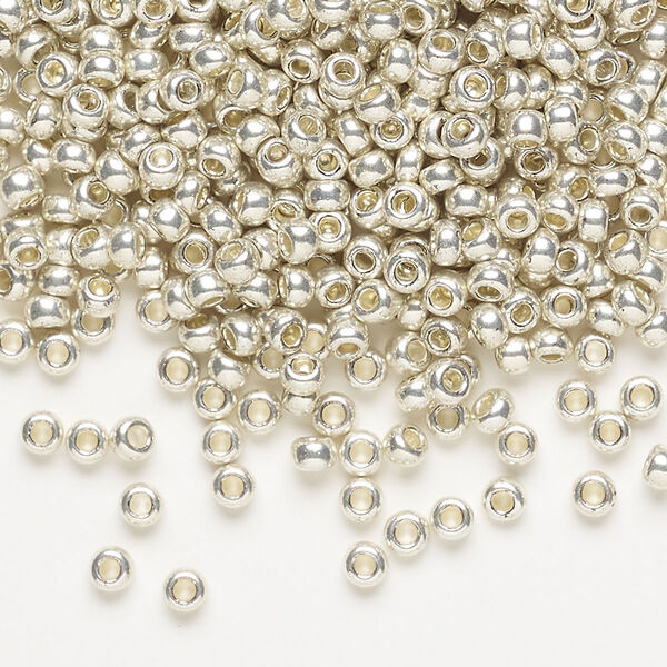 Seed bead, Preciosa Ornela Czech glass, pkg/50g, #8 rocaille, opaque metallic terra dyed silver clear, (18503). image number 0