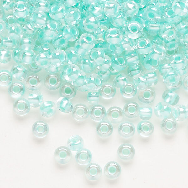 Seed bead, Preciosa Ornela Czech glass, pkg/500g, #6 rocaille, translucent color-lined luster pastel green, (382PG). image number 0
