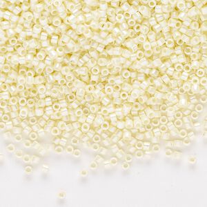 Seed bead, Delica®, glass, pkg/50g, #11 round, opaque glazed luster pale yellow (DB-1531-1).