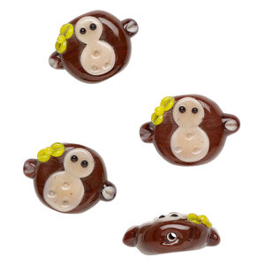 Bead, lampworked glass 1pkg4, opaque brown / peach / yellow, 28x20mm monkey head.