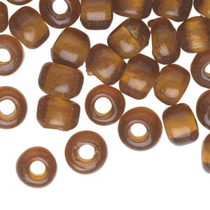 Bead, glass, transparent gold, 9x7mm crow. Sold per pkg of 100.