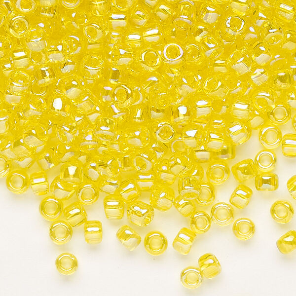Seed bead, Dyna-Mites™, glass, transparent rainbow yellow, #6 round. Sold per 40-gram pkg. image number 0