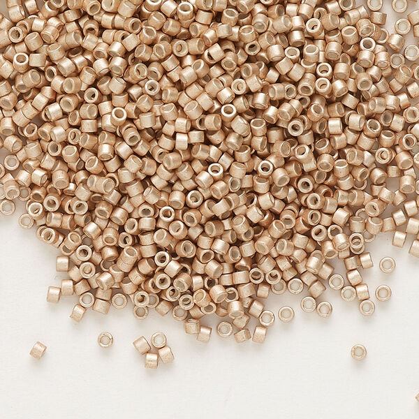 Seed bead, Delica®, glass, pkg/7.5g, #11 round, opaque semi-matte galvanized champagne (DB-1152). image number 0