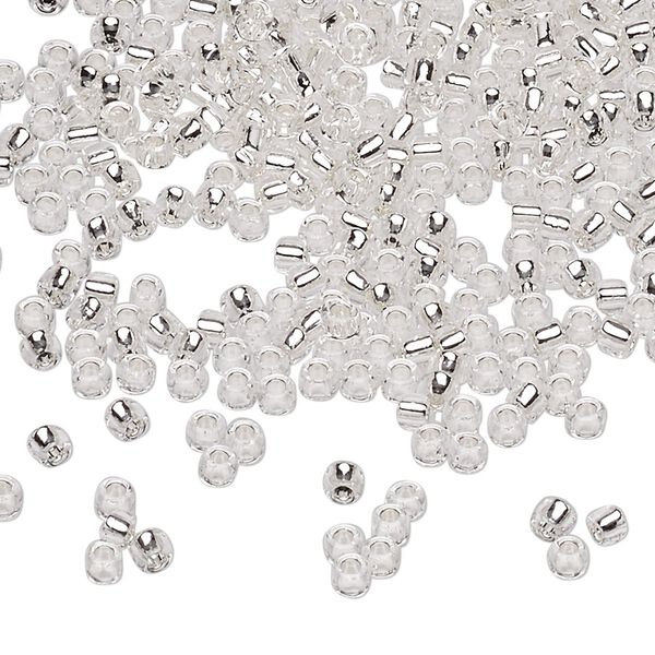 Seed bead, Dyna-Mites™, glass, silver-lined translucent clear, #8 round. Sold per 40-gram pkg. image number 0