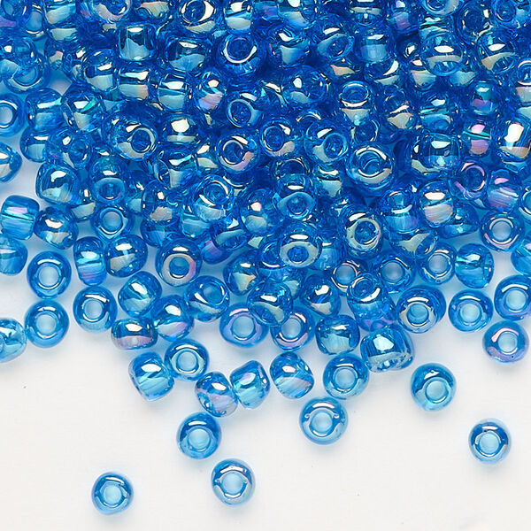 Seed bead, Dyna-Mites™, glass, transparent rainbow teal, #6 round. Sold per 40-gram pkg. image number 0