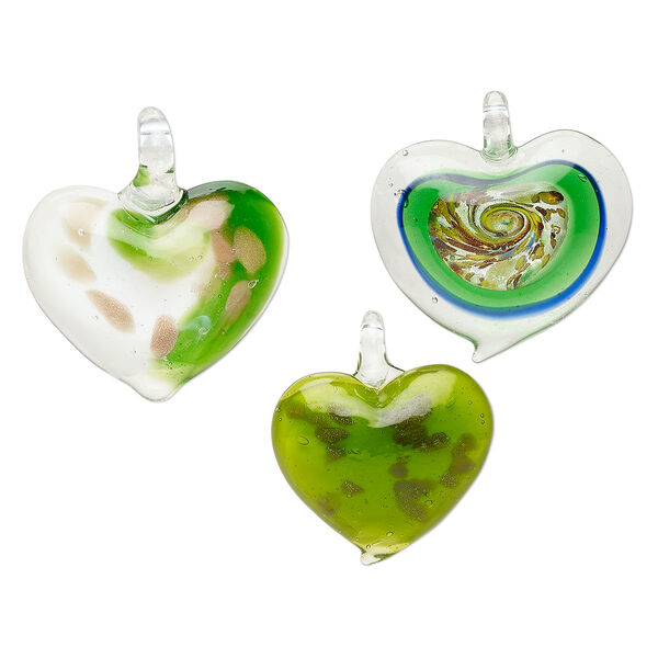 Random focal mix, lampworked glass, translucent green and multicolored, 34x32mm-42x40mm domed heart with copper-colored glitter and silver-colored foil. Sold per pkg of 3. image number 0