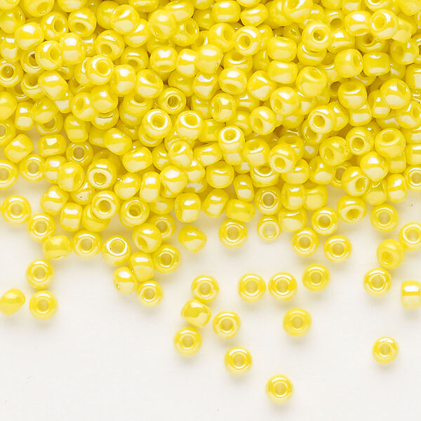 Seed bead, Dyna-Mites™, glass, opaque rainbow yellow, #8 round. Sold per 1/2 kilogram pkg. image number 0