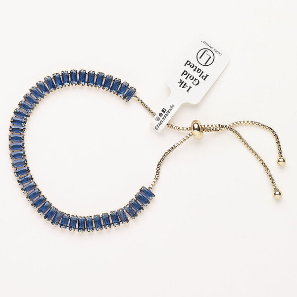 Bracelet, adjustable, brass / glass / silicone, pkg/1, 6 to 10 inches, gold plate and blue sapphire. image number 0